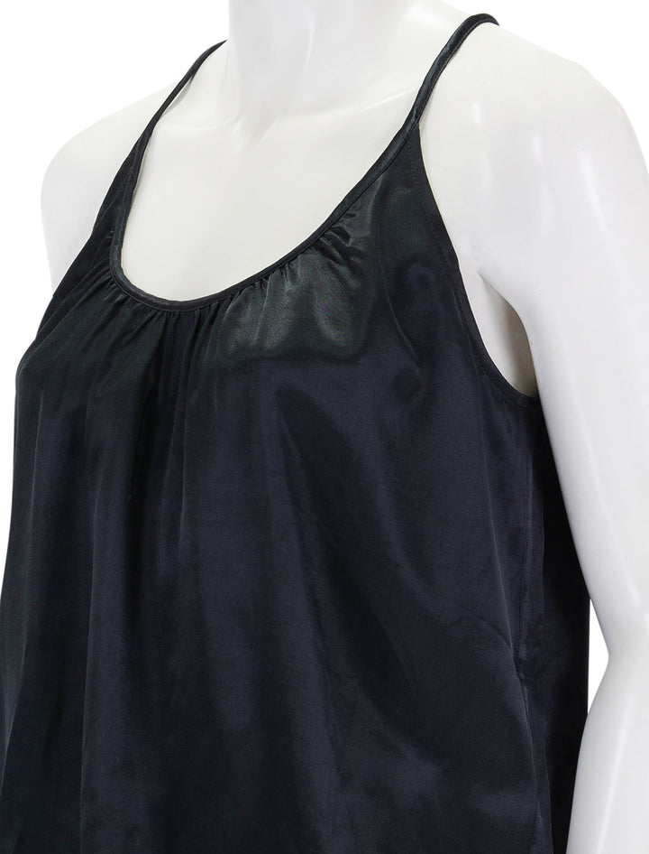 Close-up view of Nation LTD.'s lily hammered satin top in black.