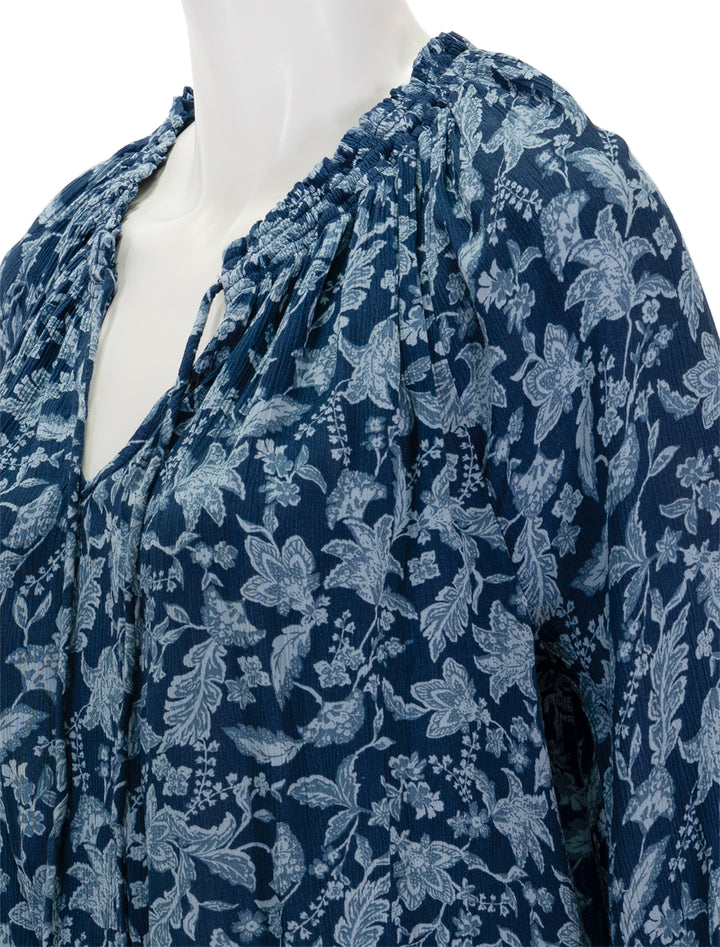 Close-up view of Faherty's emery blouse in blue esna floral.
