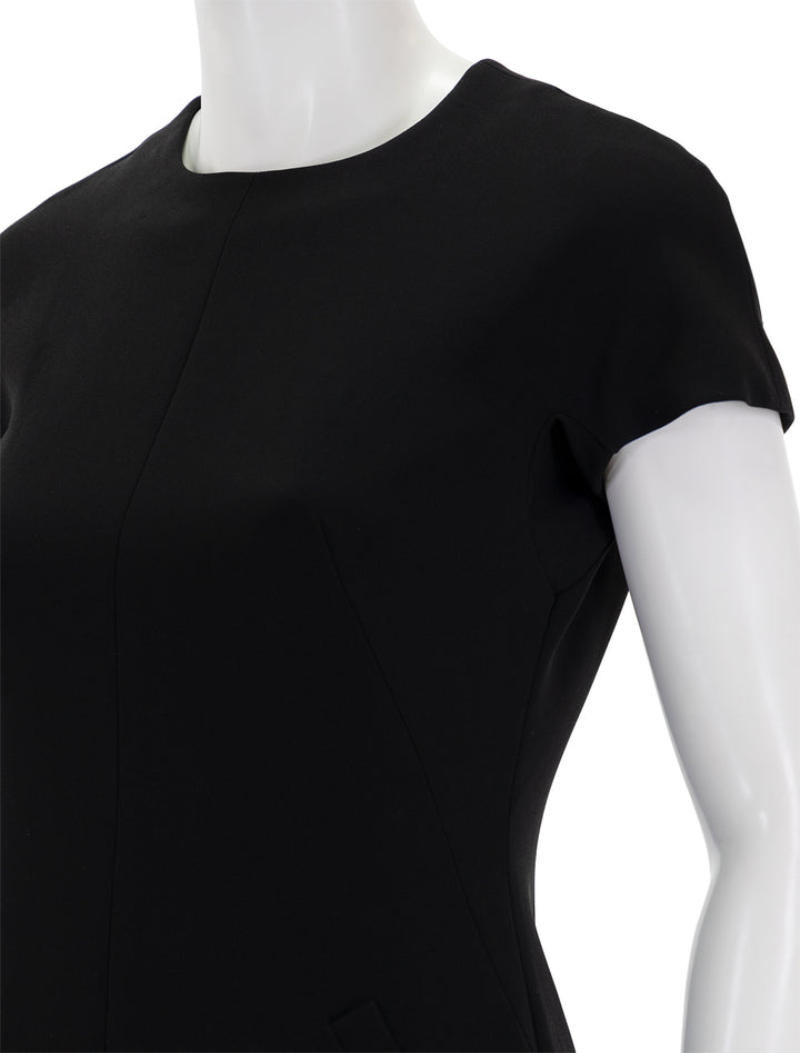Close-up view of Theory's dolman short sleeve admirable crepe dress in black.