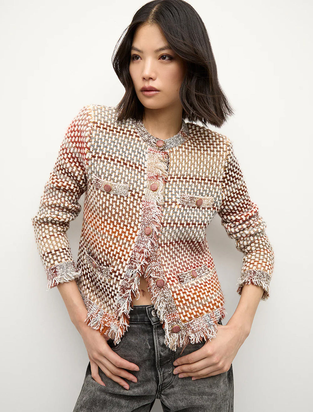 Model wearing Veronica Beard's sariyah knit jacket in red multi.