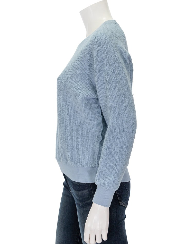 Side view of Perfectwhitetee's ziggy sweatshirt in mountain blue.