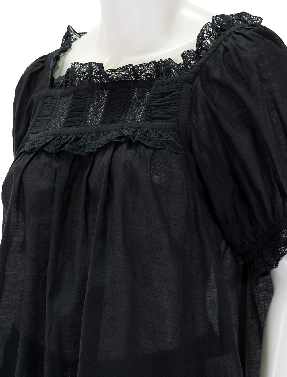 Close-up view of Doen's frances top in black.