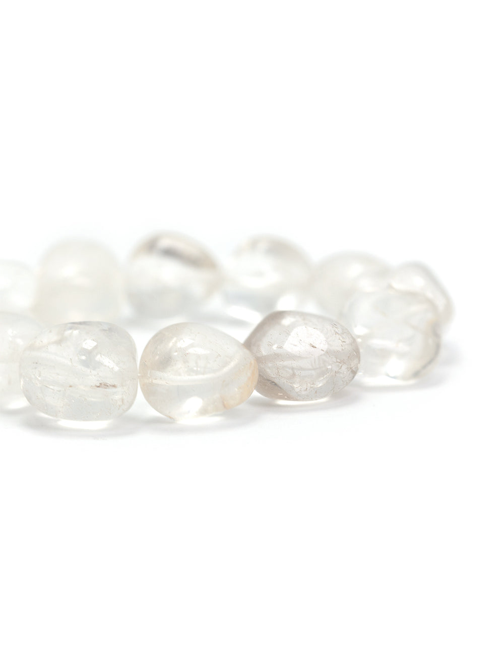 Close-up view of AV Max's crystal quartz nugget bracelet.