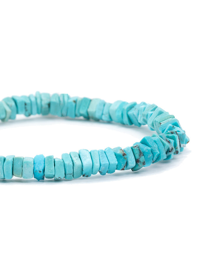 Close-up view of AV Max's turquoise squares stretch bracelet.
