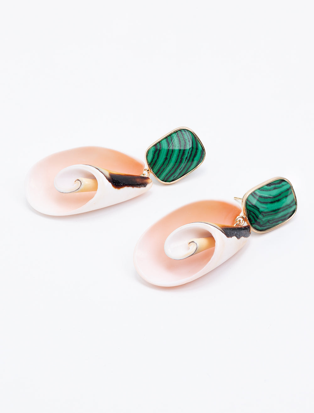 Laydown of St. Armands' malachite and pink shell earrings.