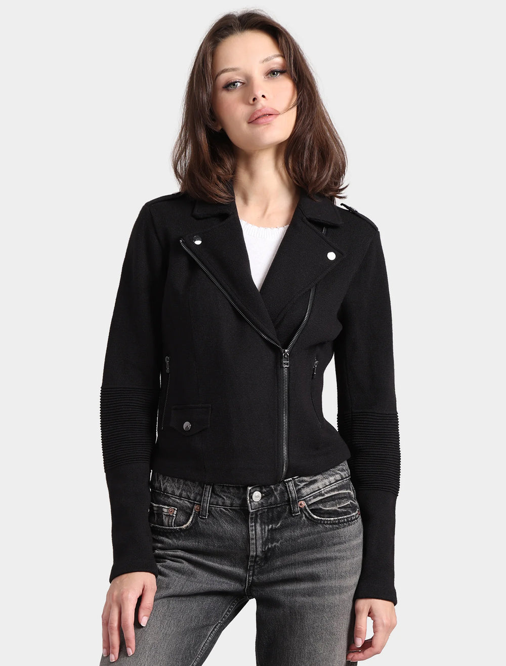 Model wearing Minnie Rose's cotton blend moto jacket in black.