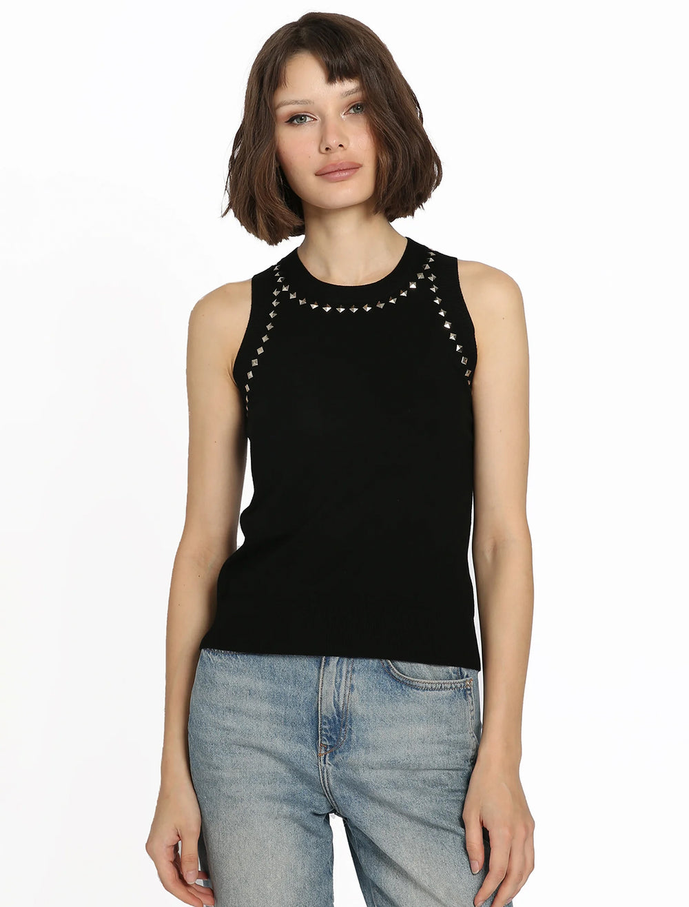 Model wearing Minnie Rose's knit tank with stud accents.