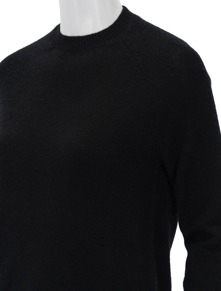 Close-up view of Minnie Rose's cashmere shrunken crew in black.