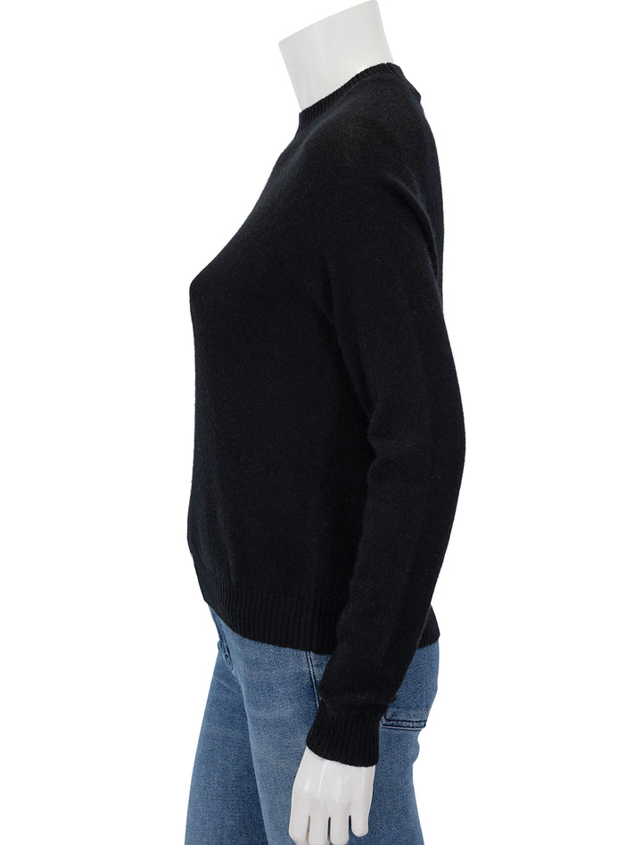 Side view of Minnie Rose's cashmere shrunken crew in black.