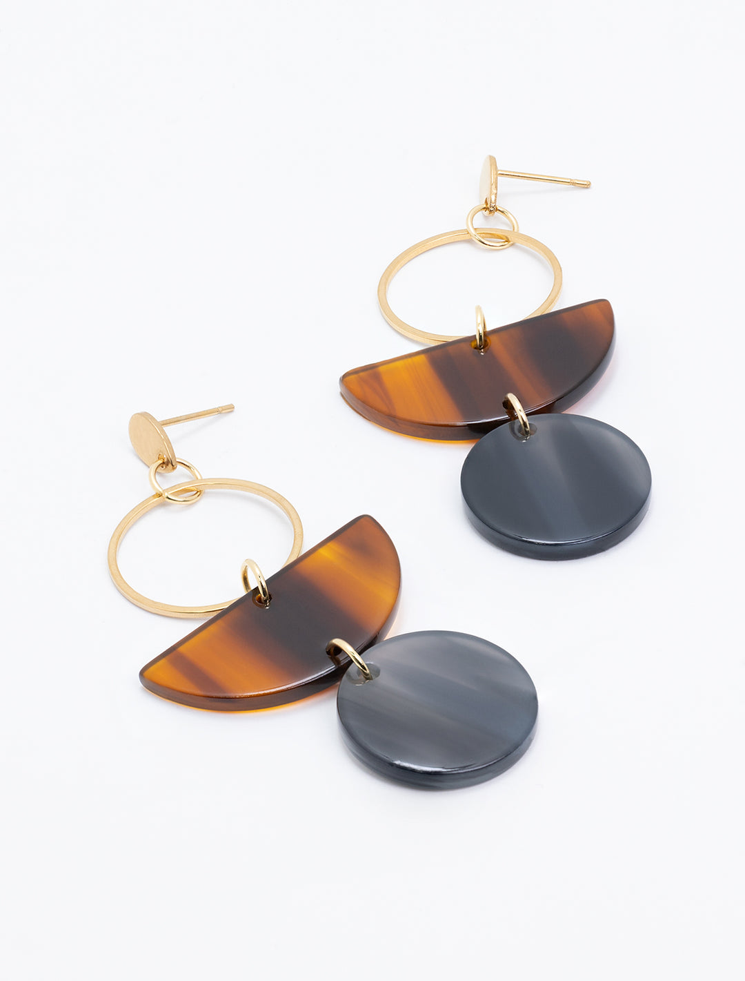 Laydown of S&S's wren earrings in walnut and black.