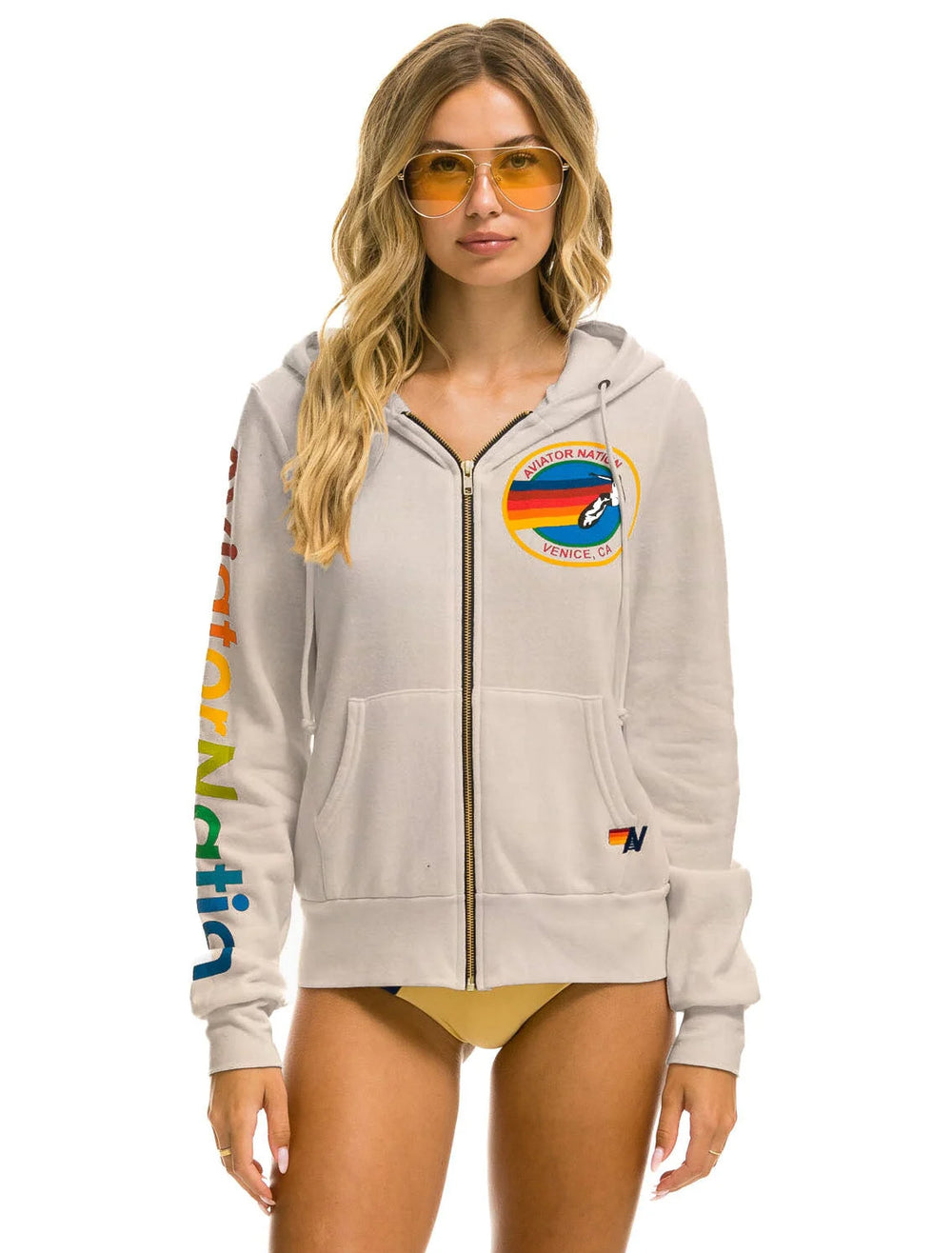 model wearing aviator nation zip hoodie in sand