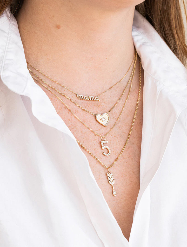 Model wearing Sydney Evan's mama script necklace.