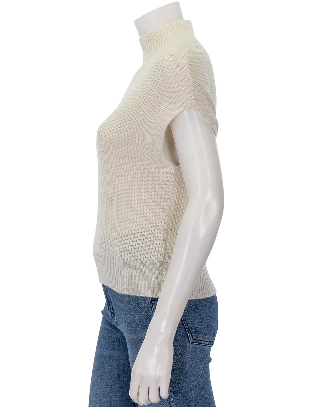 Side view of Lilla P.'s ribbed funnel neck sweater in ivory.