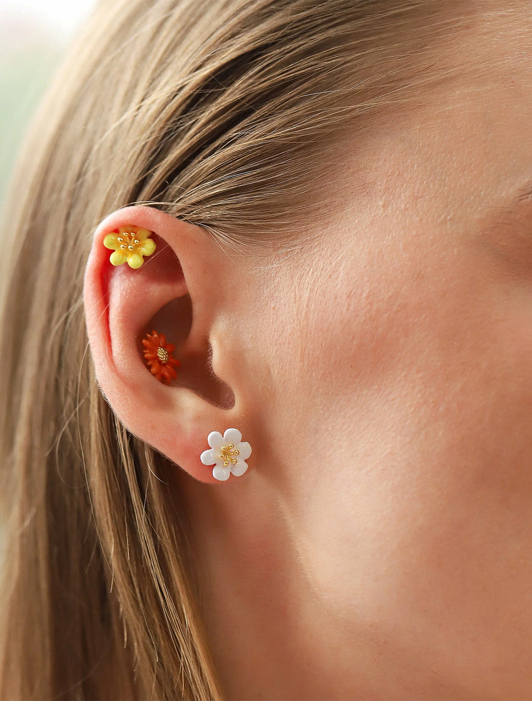 Model wearing Tai's gerbera daisy studs.