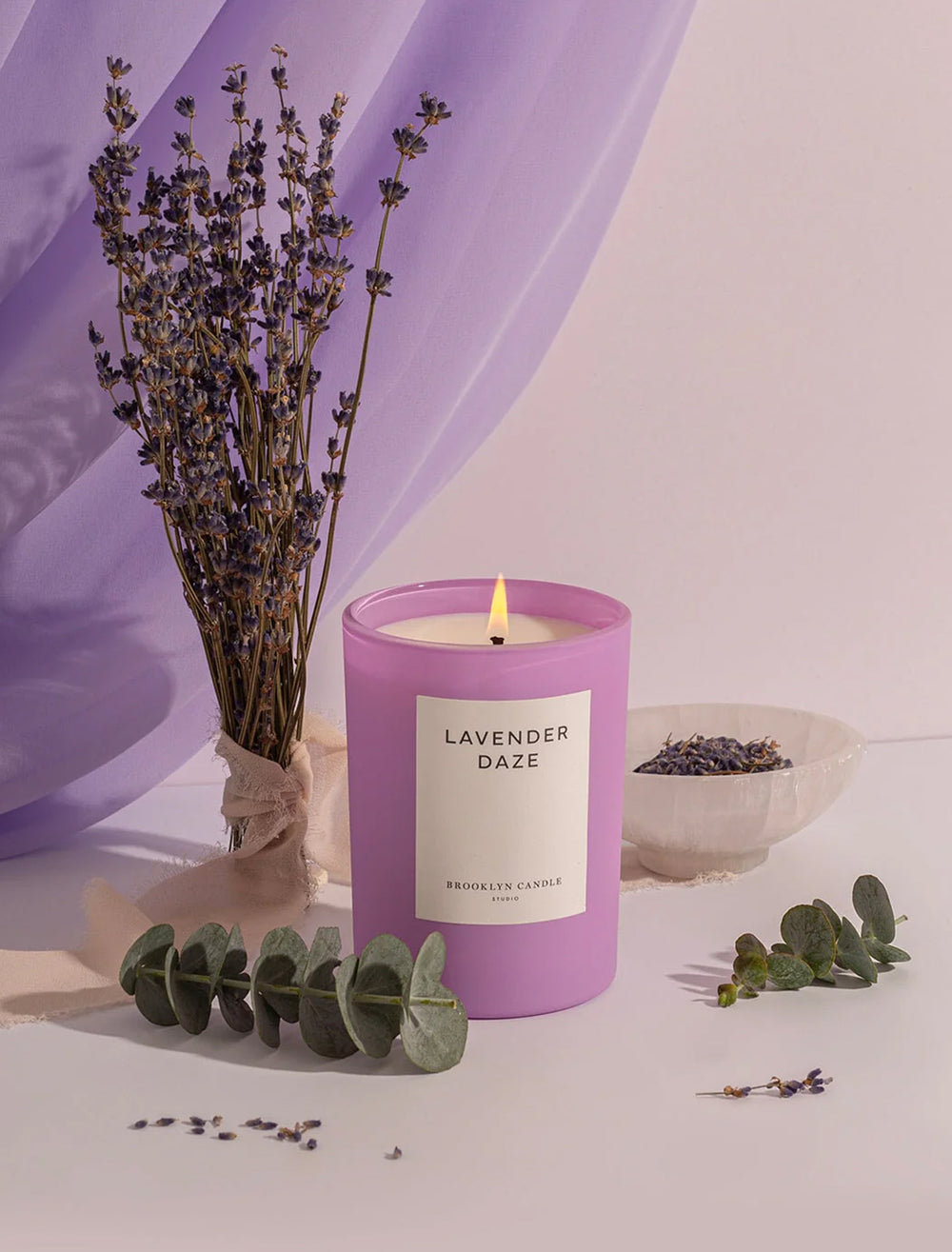 Stylized photo of Brooklyn Candle Studio's lavender daze candle.