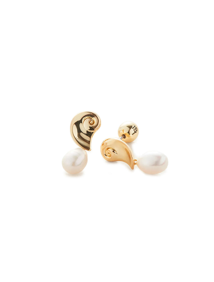 Close-up view of Jenny Bird's lucille earrings in gold.