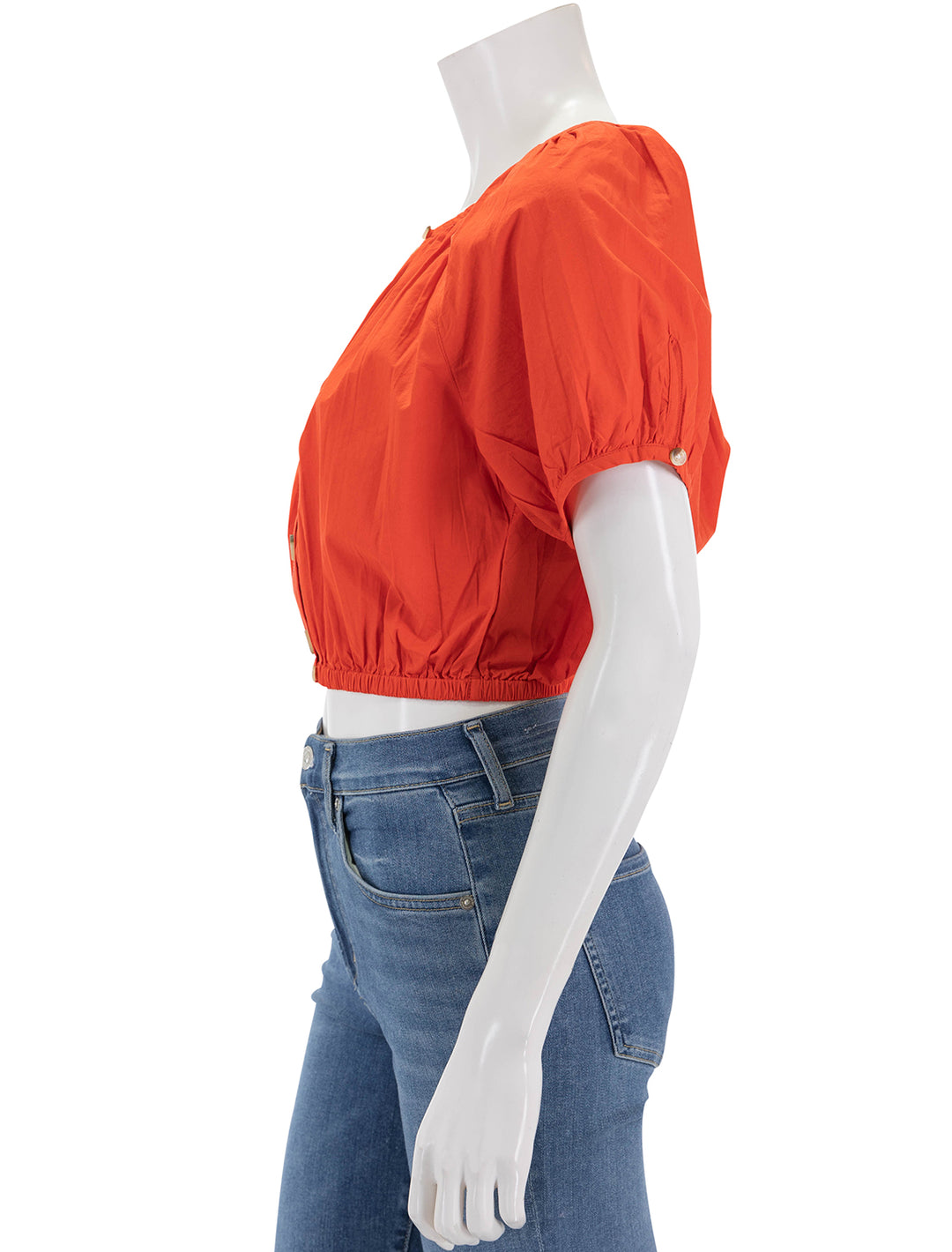 Side view of Lilla P's elastic hem button front top in poppy.