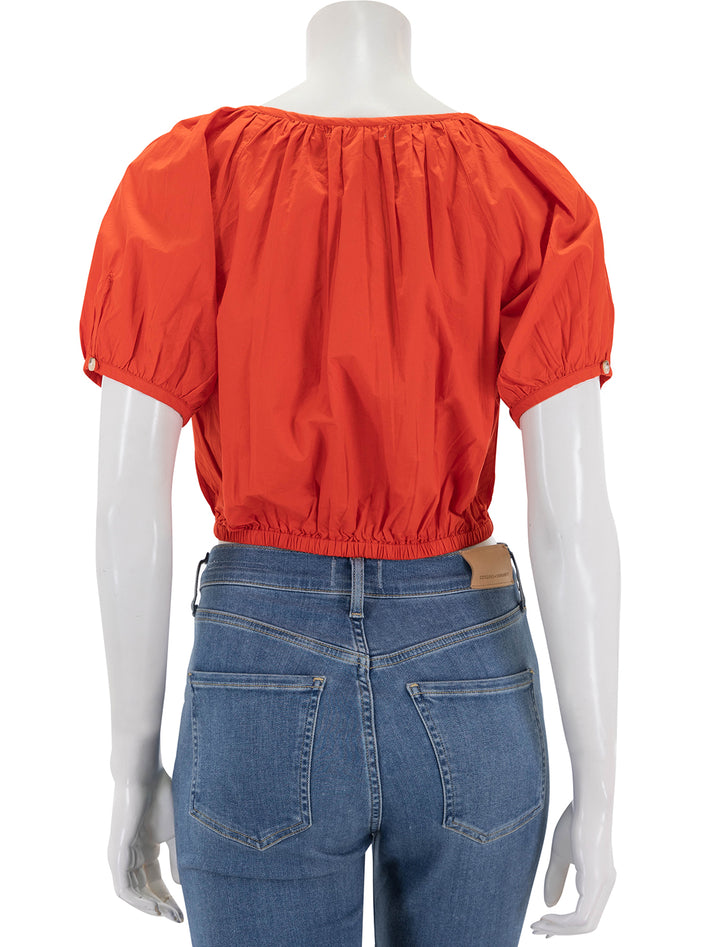 Back view of Lilla P's elastic hem button front top in poppy.