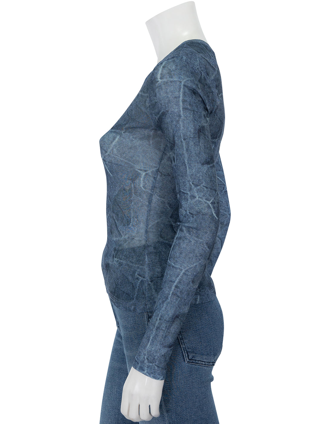 Side view of GANNI's marl mesh long sleeve crew neck blouse in denim.