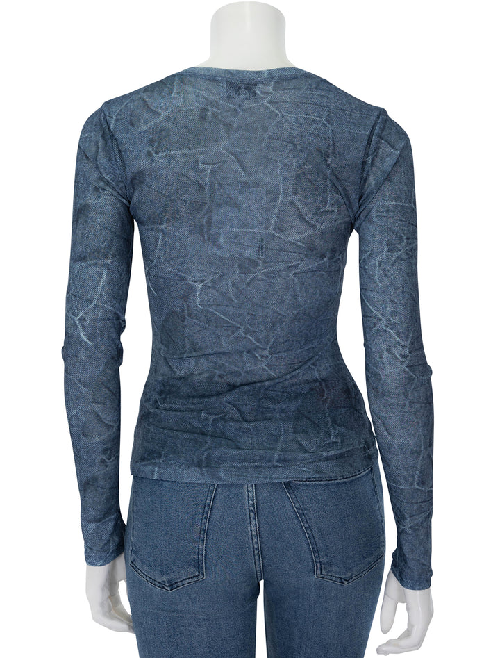 Back view of GANNI's marl mesh long sleeve crew neck blouse in denim.