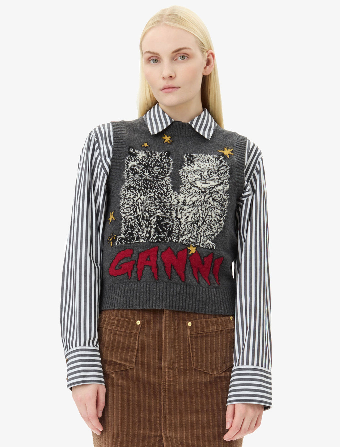 Model wearing GANNI's graphic wool mix cats vest.