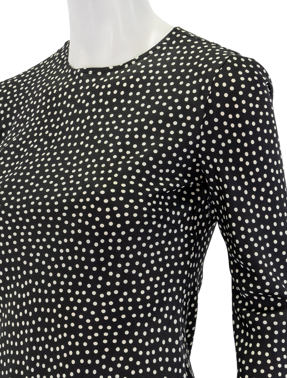 Close-up view of Doen's narcisse dress in scattered dot print.