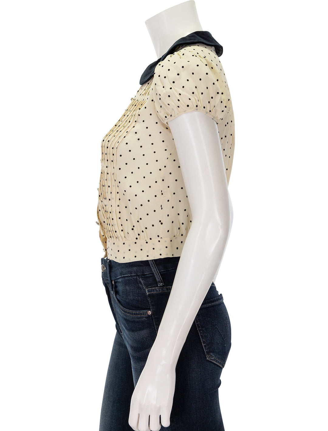 Side view of Doen's madeline top in mother of pearl dot.