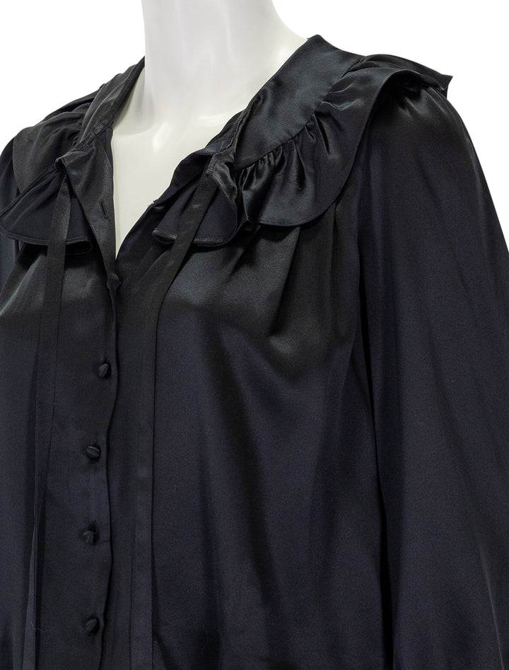 Close-up view of DOEN's solange top in black.