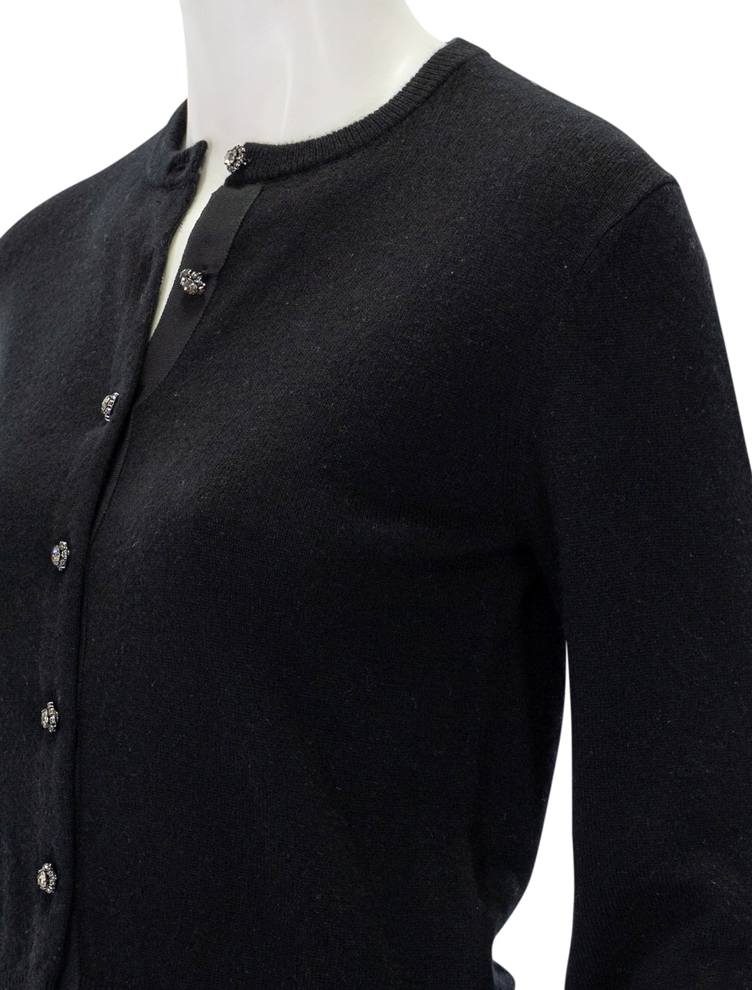 Close-up view of DOEN's ida cardigan in black.