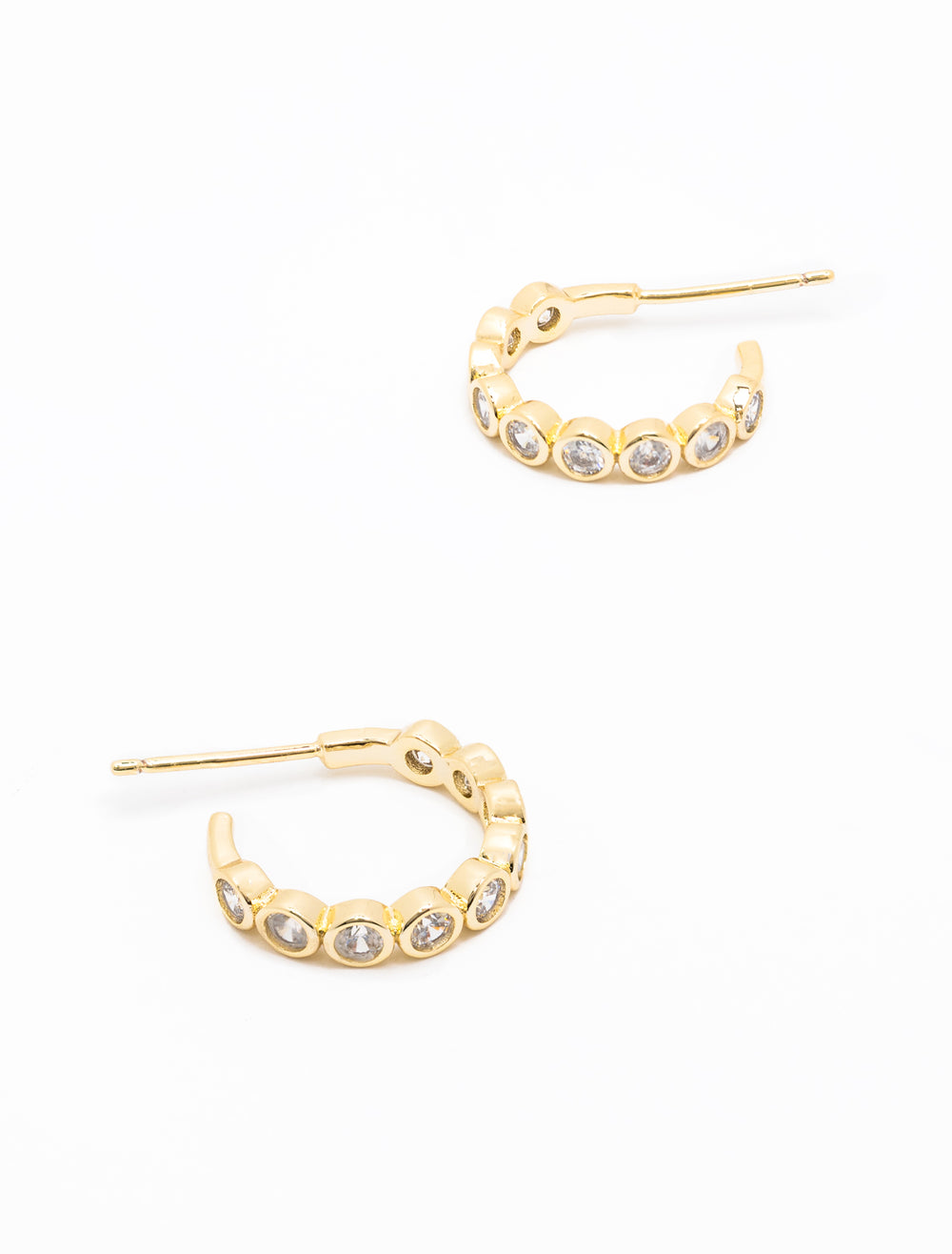 Close-up view of AV Max's Bezel Set CZ Baby Hoops in Gold.
