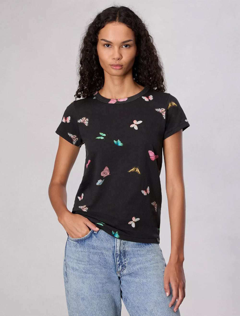 model wearing all over butterfly tee in black