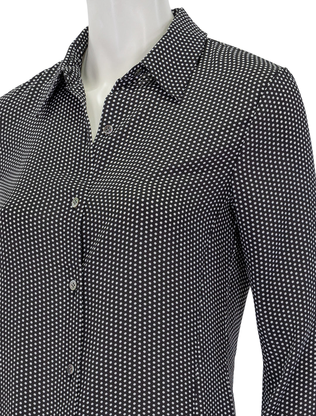 Close-up view of Theory's slim button down in black and white pindot.