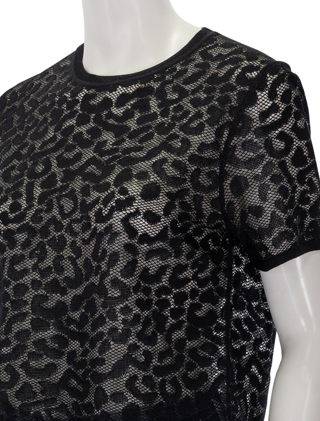 Close-up view of Theory's Cheetah Print Lace Tee in Black.