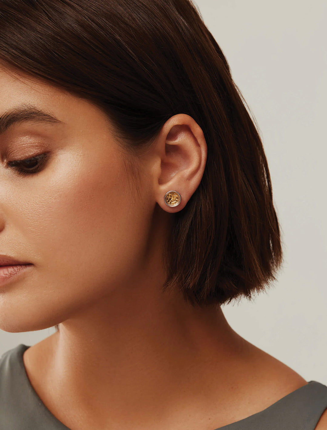 Model wearing Anna Beck's gili silver and gold dish earrings.