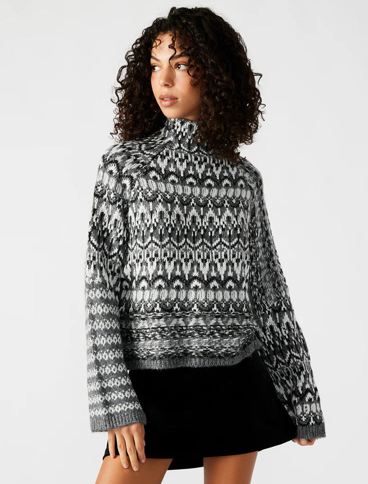 Model wearing Steve Madden's indie sweater in charcoal.