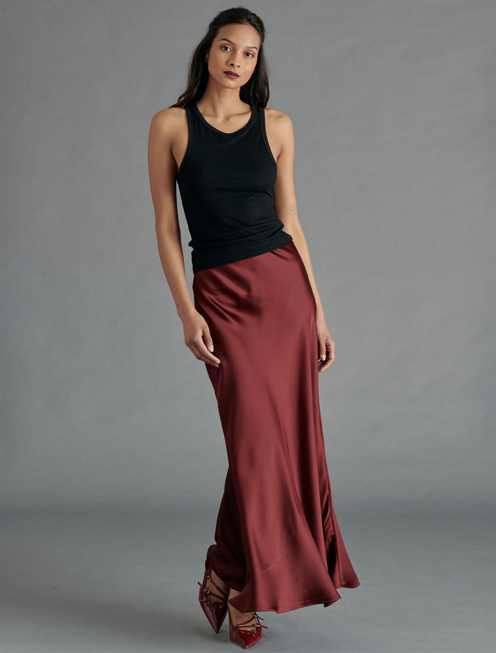 Model wearing Steve Madden's jeannie skirt in cabernet.