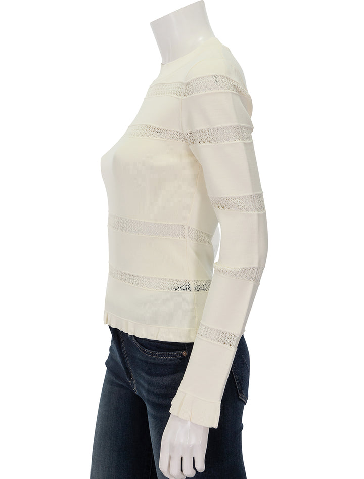 Side view of Sea NY's devon knit long sleeve top in cream.