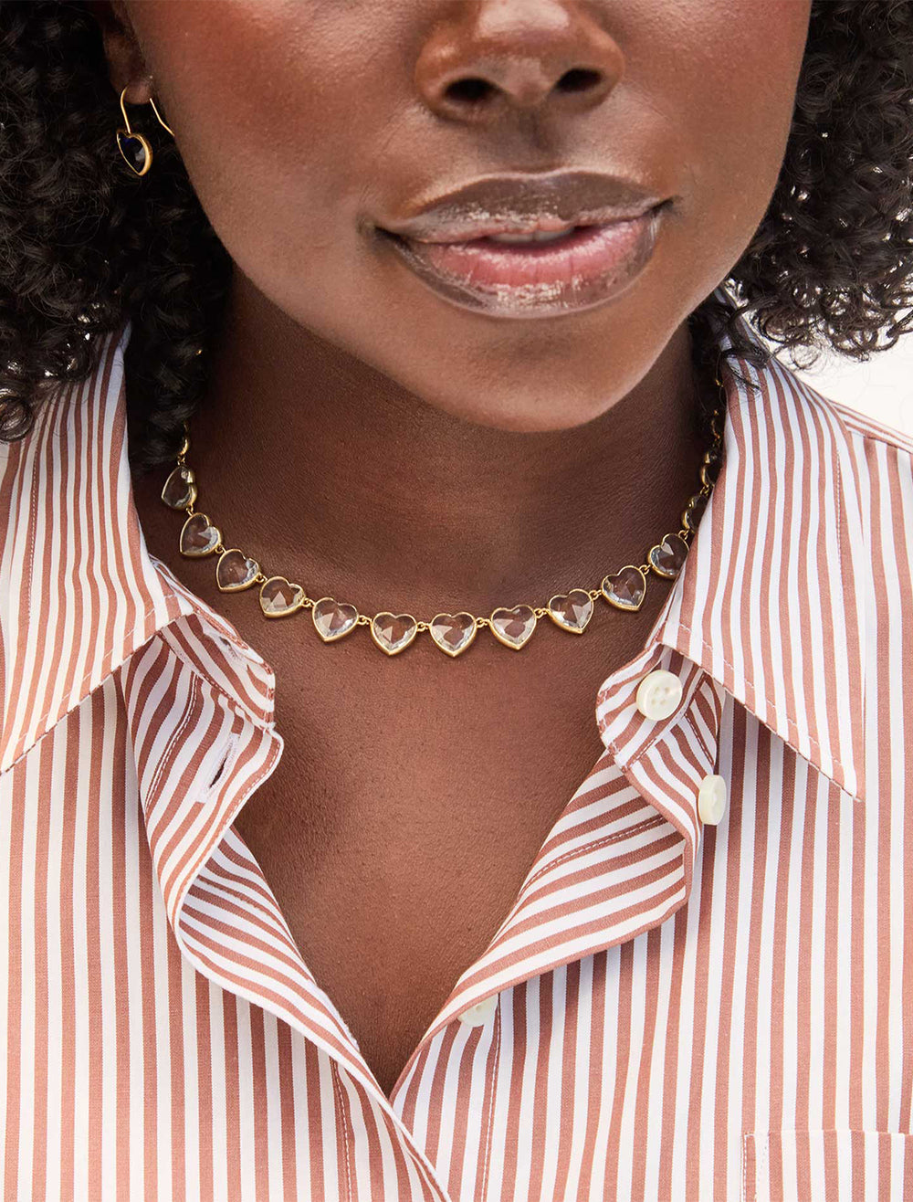 model wearing bezel heart necklace