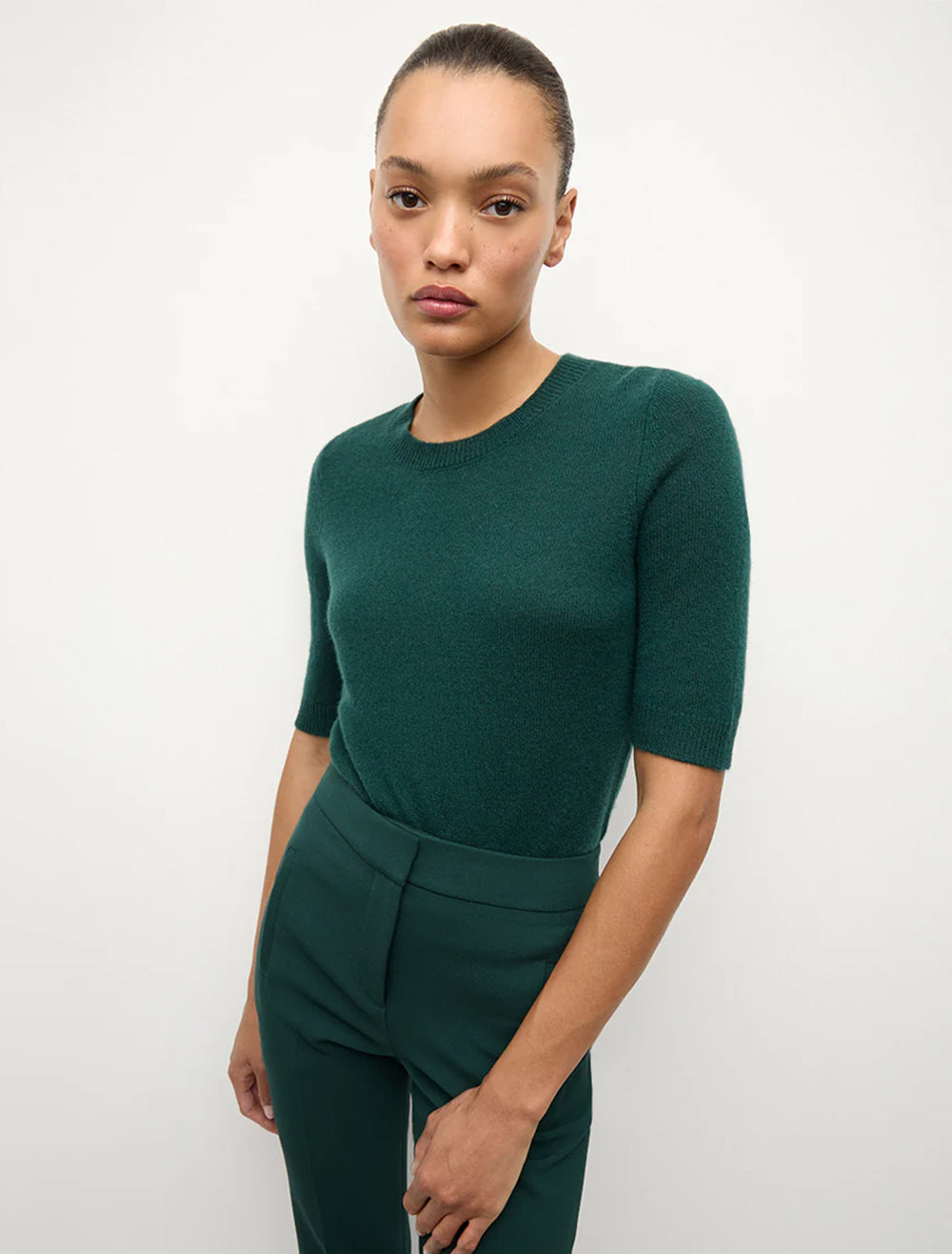 Model wearing shana cashmere sweater in pine.