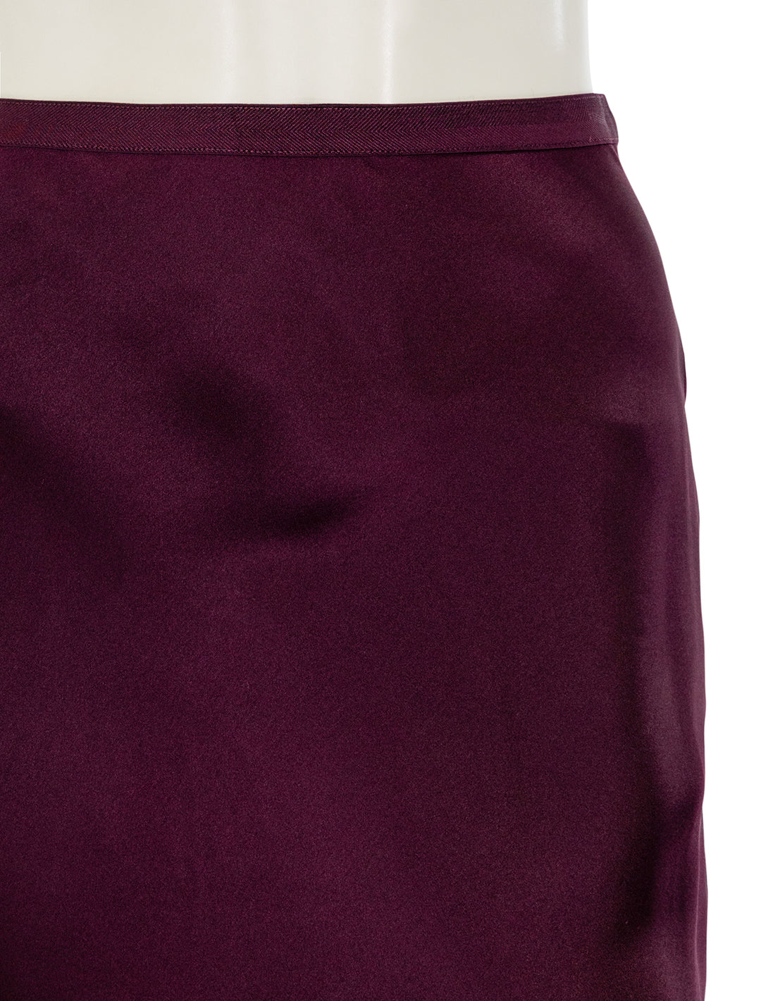 Close-up view of Anine Bing's bar silk skirt in bordeaux.