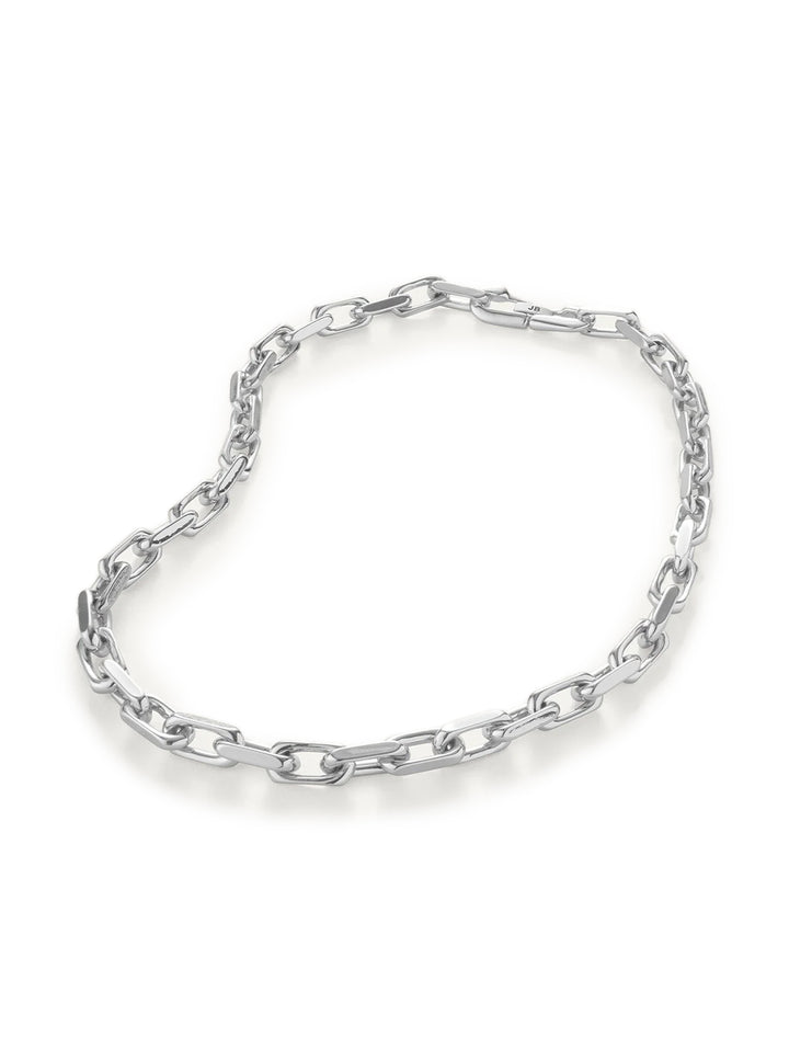 Laydown view of Jenny Bird's loire necklace in silver.