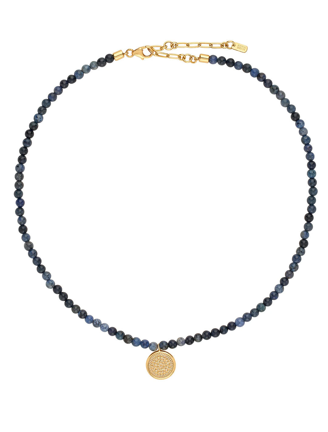 Overhead view of Anna Beck's dumortierite beaded necklace with medium gold pendant.