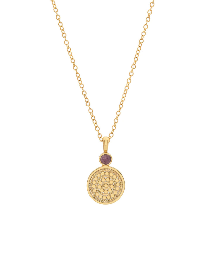 Front view of Anna Beck's pink ruby and circle pendant necklace.