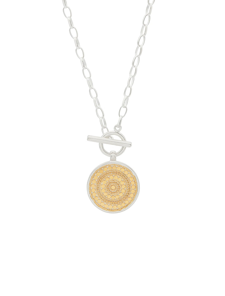 Front view of Anna Beck's classic dotted circle toggle necklace.