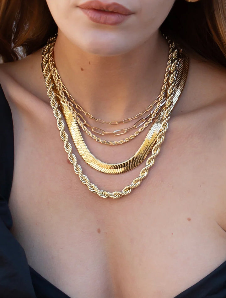 Model wearing Joy Dravecky's monaco choker in gold.