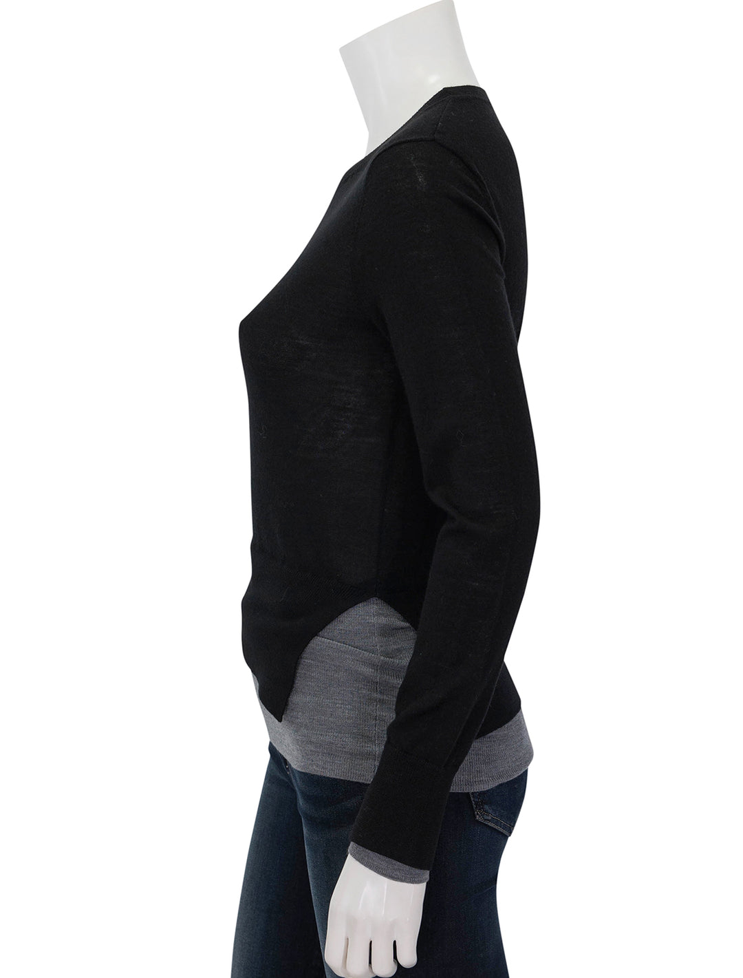 Side view of Saint Art's myra layered sweater in black and grey.