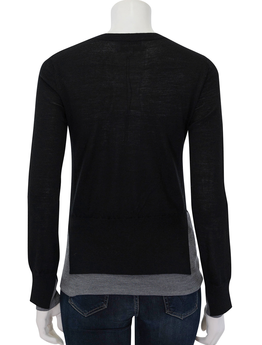 Back view of Saint Art's myra layered sweater in black and grey.