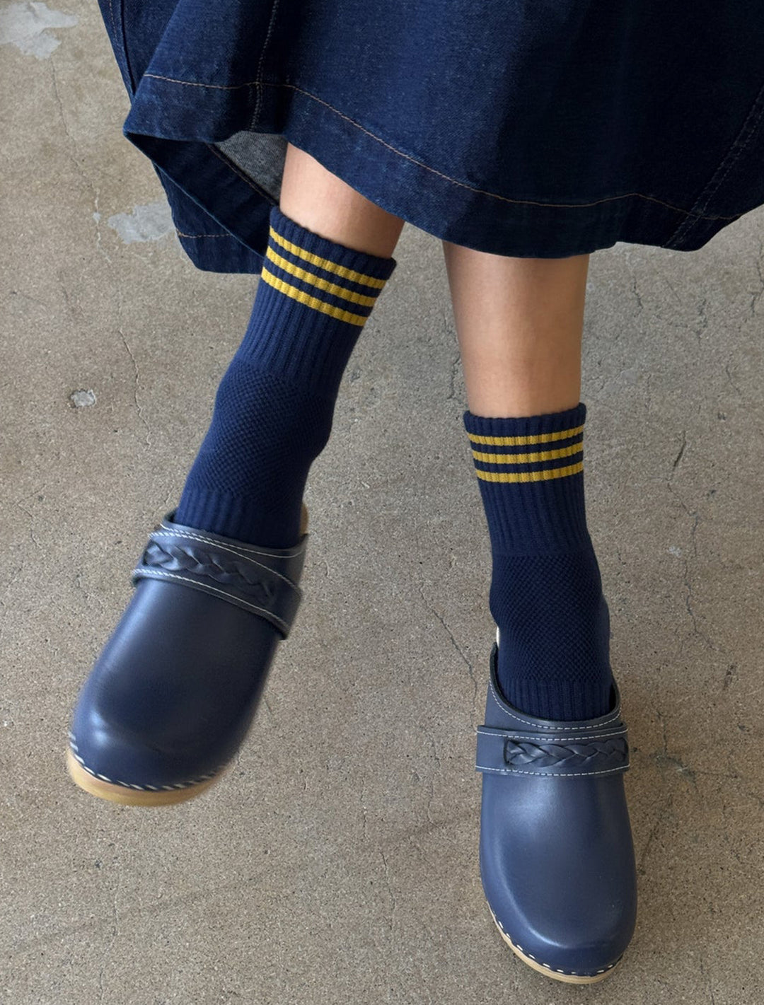 Model wearing Le Bon Shoppe's girlfriend socks in navy.