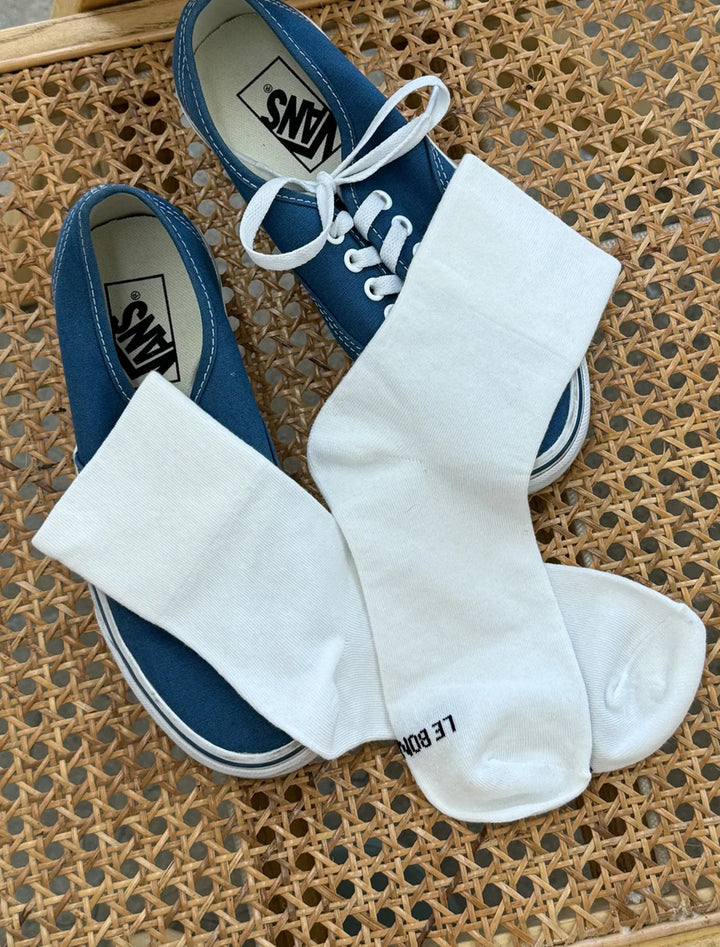 Laydown of Le Bon Shoppe's sneaker socks in classic white.