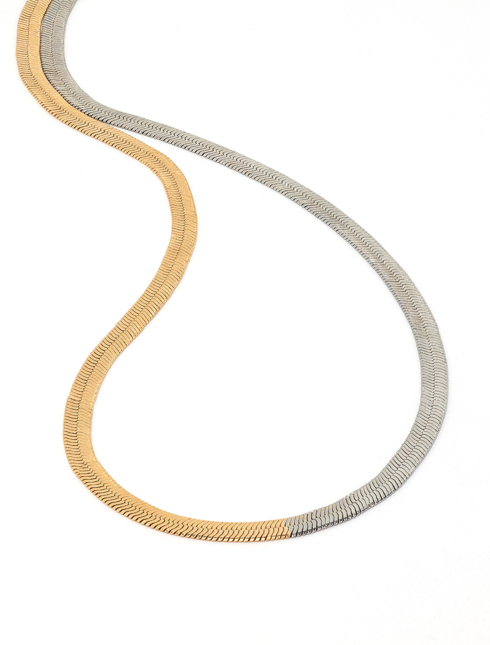 Close-up view of Jonesy Wood's jennings two tone snake chain necklace.